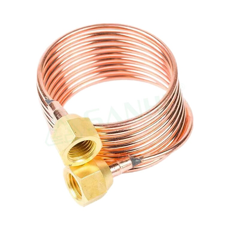 Copper tube coil with brass fittings, used in HVAC systems for efficient refrigerant flow and connection.
